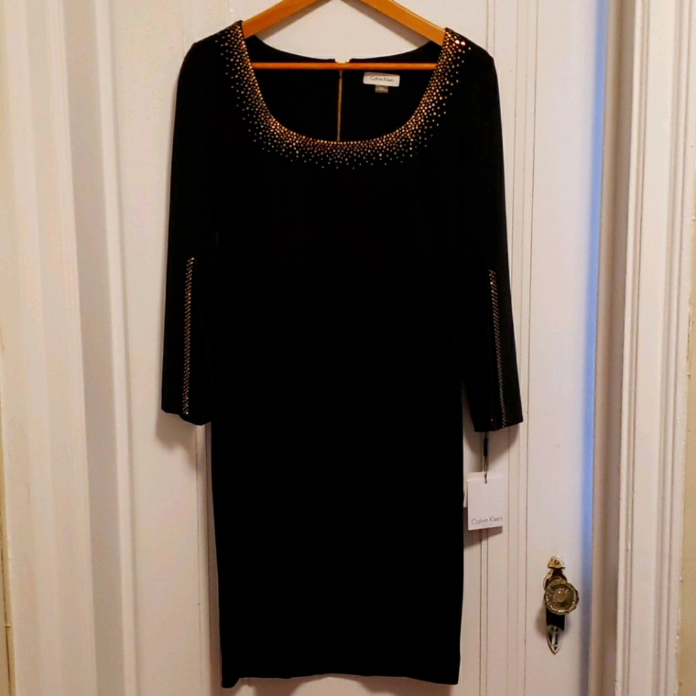 Elegant black Calvin Klein w/gold trim dress